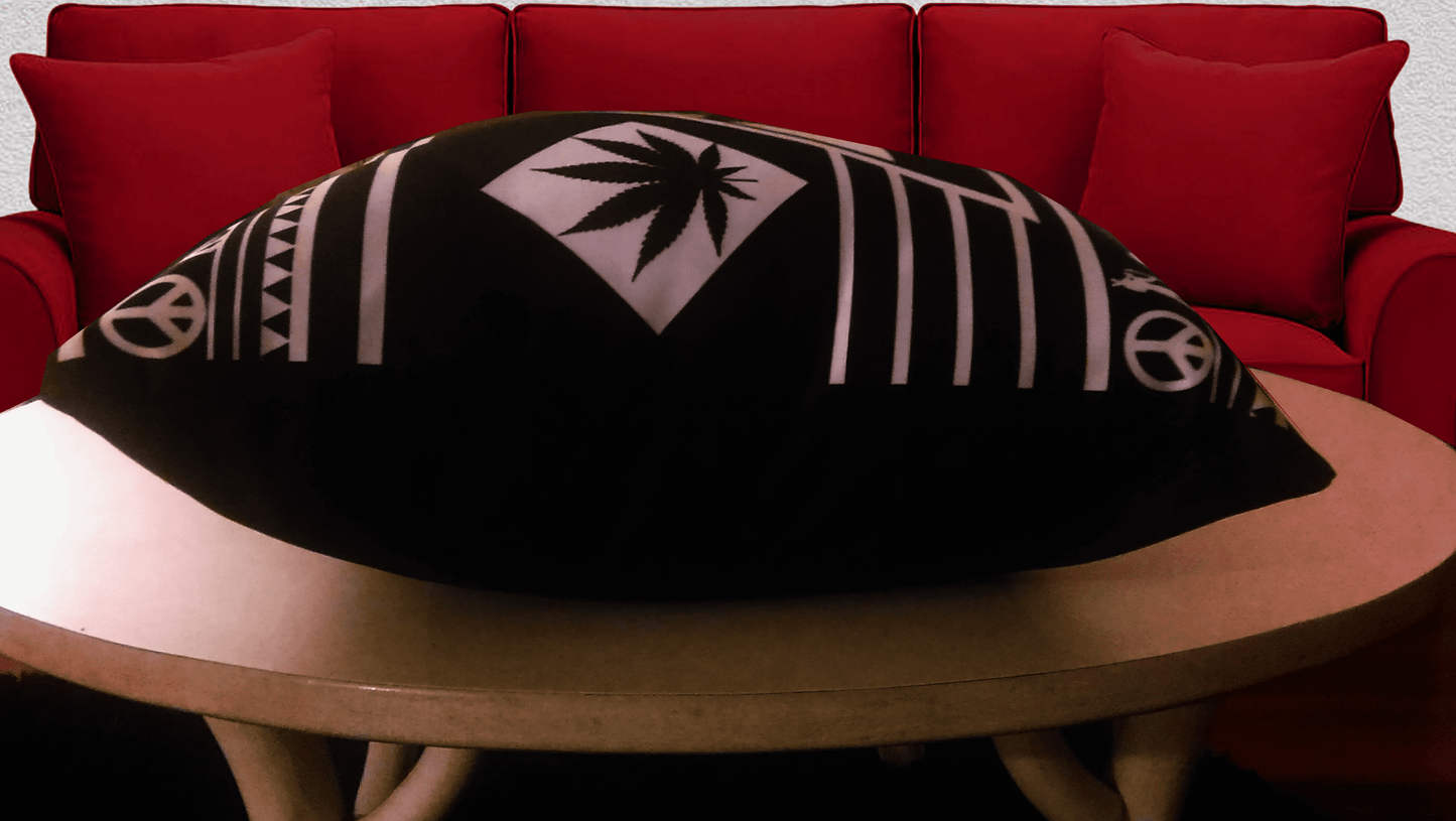 Black and white decorative pillow with a unique marijuana-inspired design.
