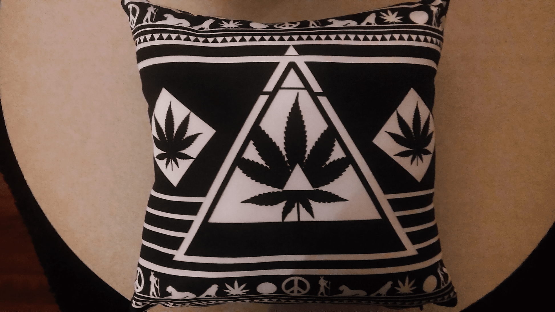 Modern black and white throw pillow with a cool, abstract leaf pattern.